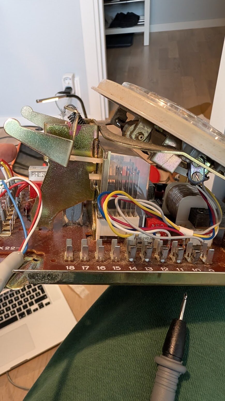 Probing the terminal connectors and examining the leaf switch mechanism under the cradle lever